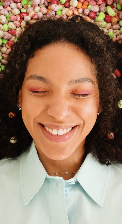 Woman Surrounded with Small Easter Eggs